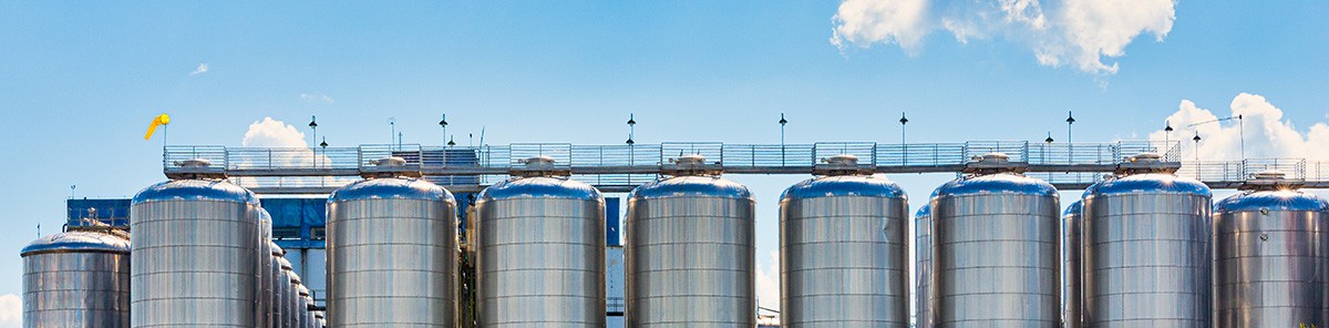 Fermentation tanks for beer with beautiful sky